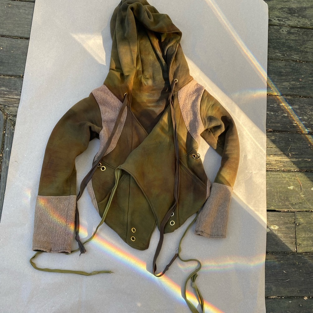 Rare one of a kind Thick handmade jacket with brass detailing, ties and hood.